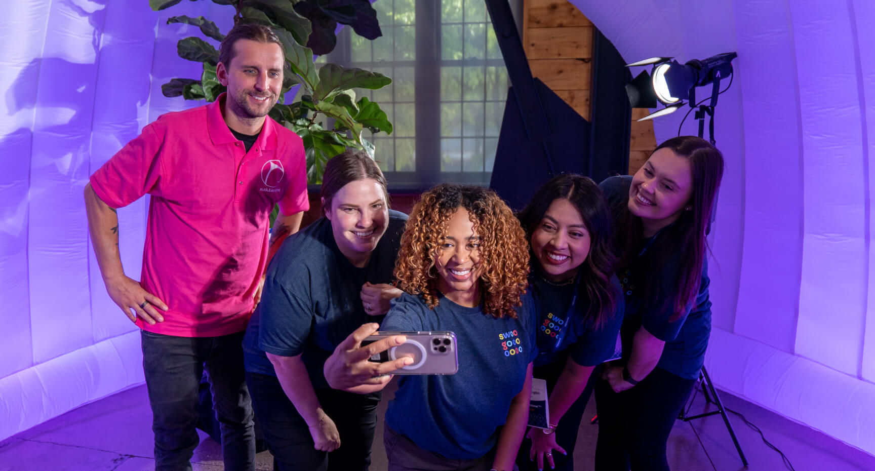 People taking a selfie in the UnconIRL 2023 photobooth